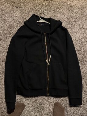 Louis Vuitton navy label with gold lettering